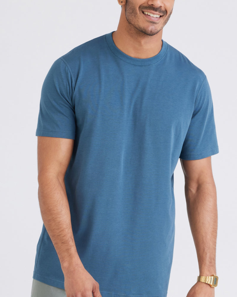 A close up of a man wearing a blue t-shirt.