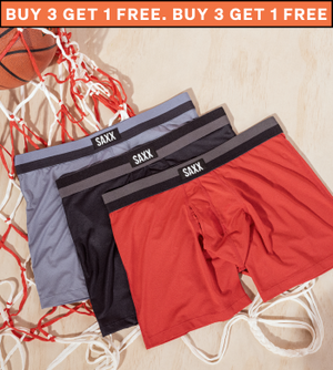 Three pairs of boxer briefs laid on top of a loose basketball net with a basketball inside of it. The boxer briefs are red, black, and light blue.