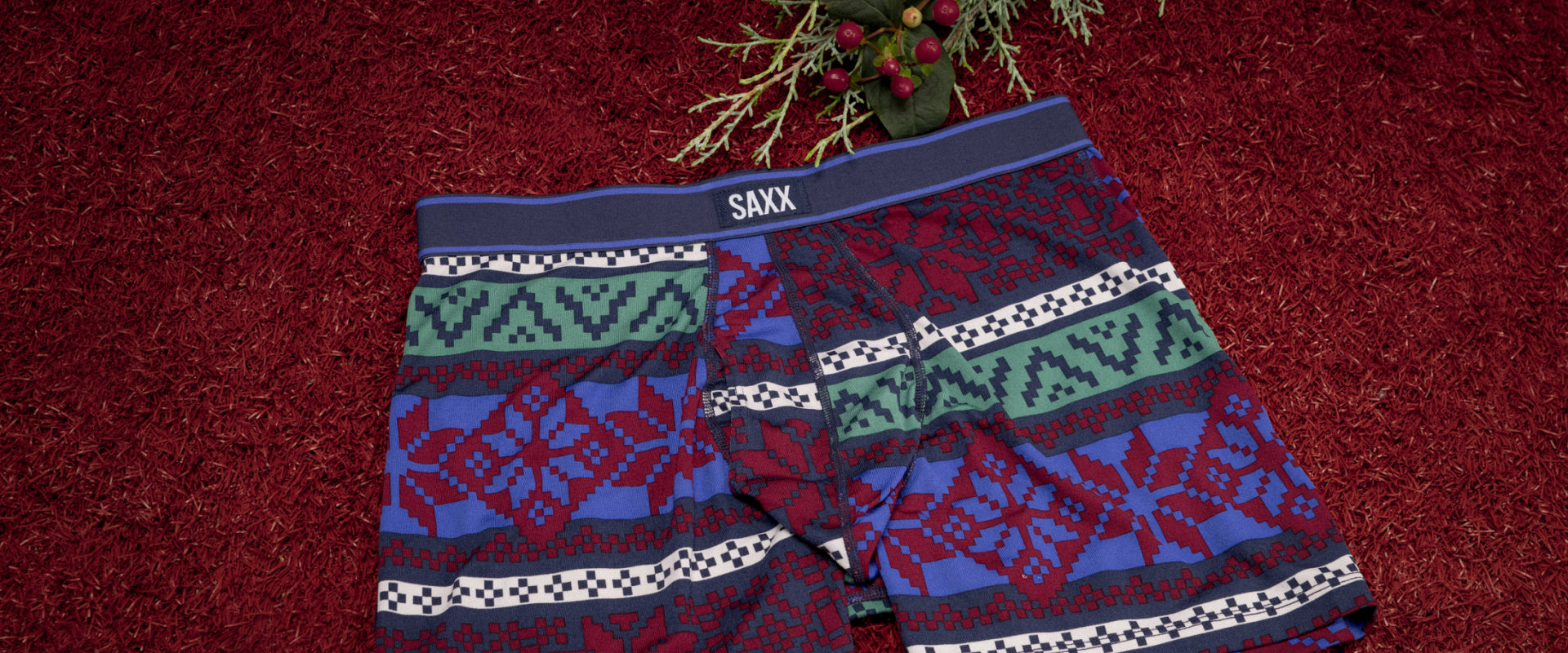 A close up image of a pair of underwear with a multi-colored fair-isle design printed on them.