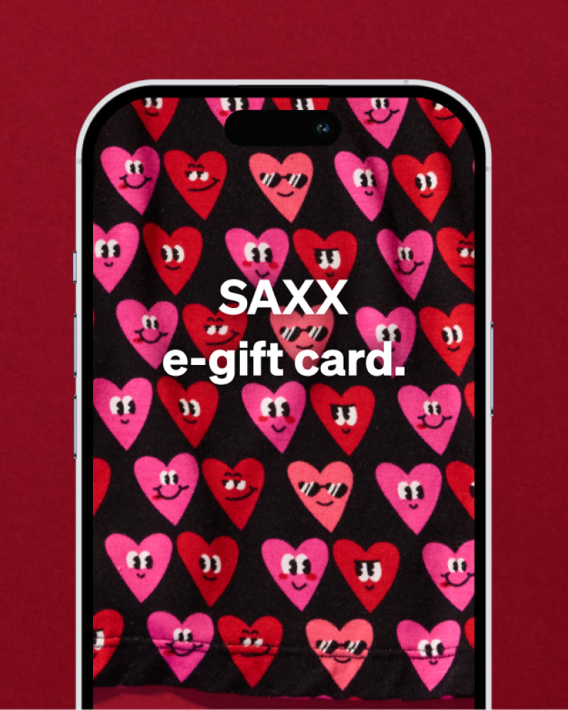 Iphone screen with smiley-faced heart pattern and text ‘SAXX e-gift card’ over a red background.