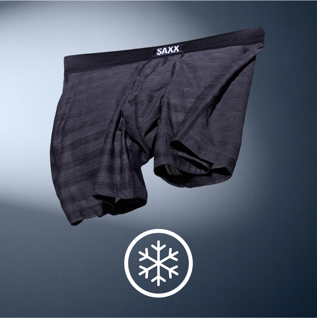 Grey striped SAXX Boxer Briefs floating over a grey background. White icon indicates DropTemp® Cooling technology.