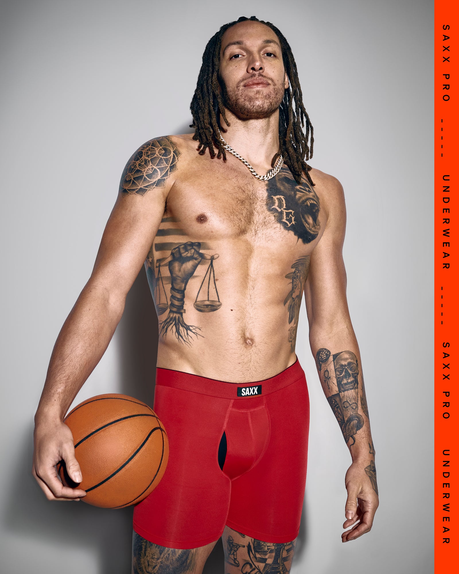 SAXX Gamechanger and Pro Basketball Player Aaron Gordon wearing Multi-Sport Mesh Boxer Brief in Sunset Red
