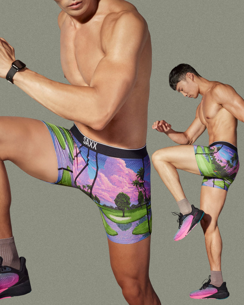 Man in two dynamic workout poses wearing multi-color printed SAXX Boxer Briefs against a neutral backdrop. 