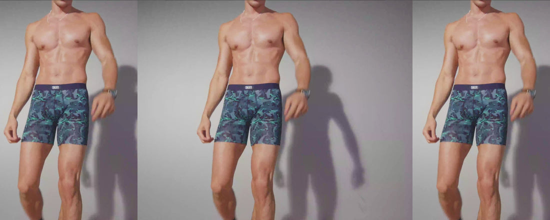 A gif of a male model from neck down wearing blue patterned SAXX Boxer Briefs dancing.