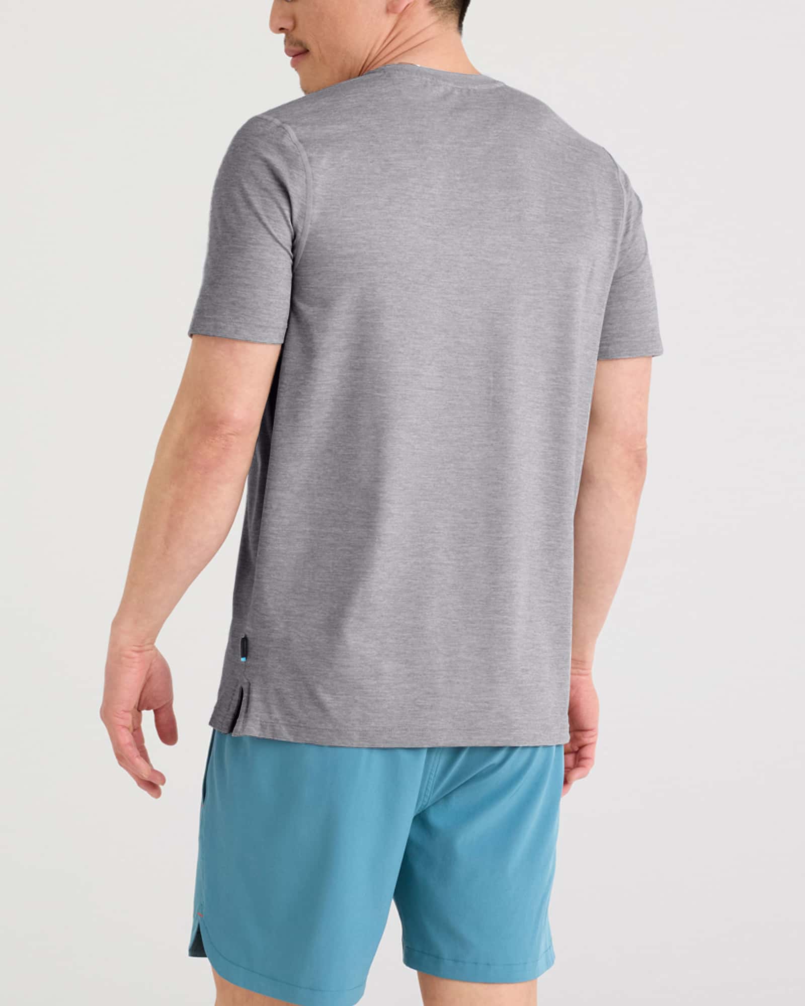 Back - Model wearing Droptemp All Day Cooling Short Sleeve Tee in Tradewinds Heather