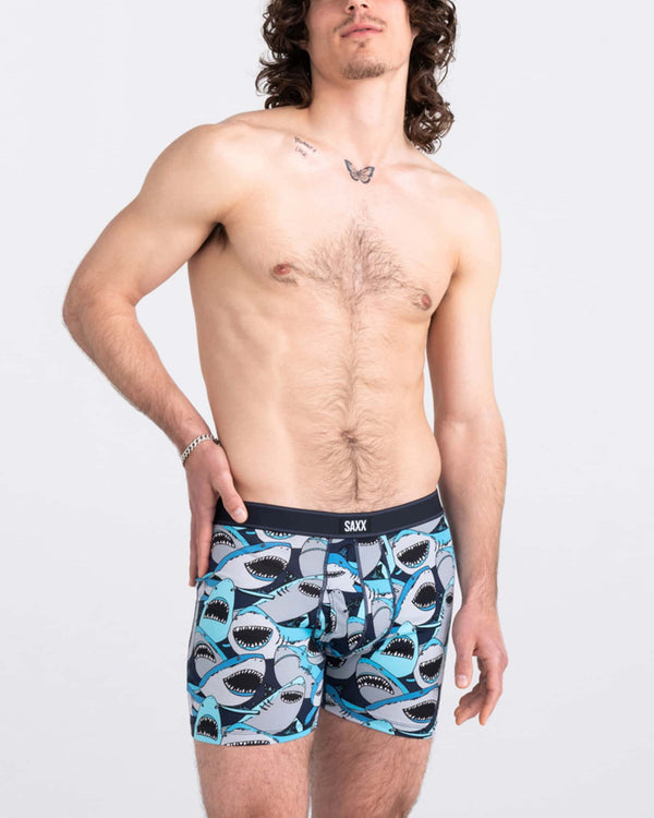 Front - Model wearing Daytripper Boxer Brief Fly in Shark Tank Camo- Navy