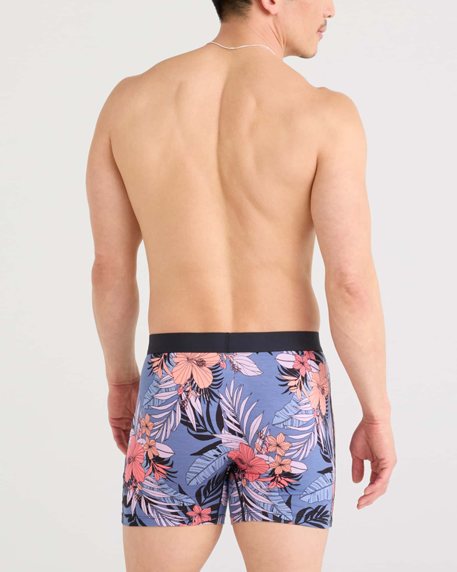 Back - Model wearing Ultra Super Soft Boxer Brief Fly in Hibiscus Jungle-Blue