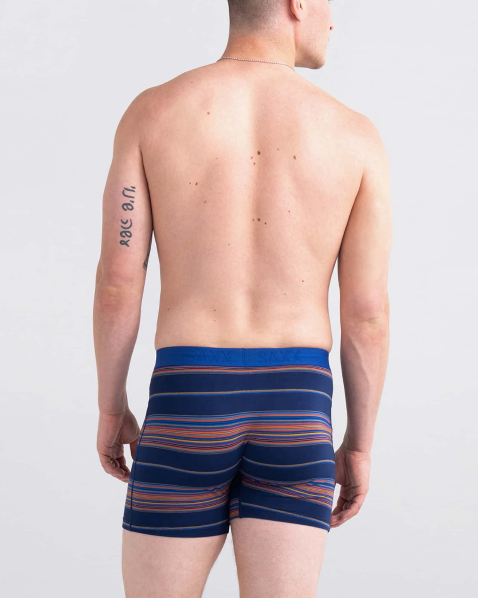 Back - Model wearing Ultra Super Soft Boxer Brief Fly in Horizon Stripe- Navy