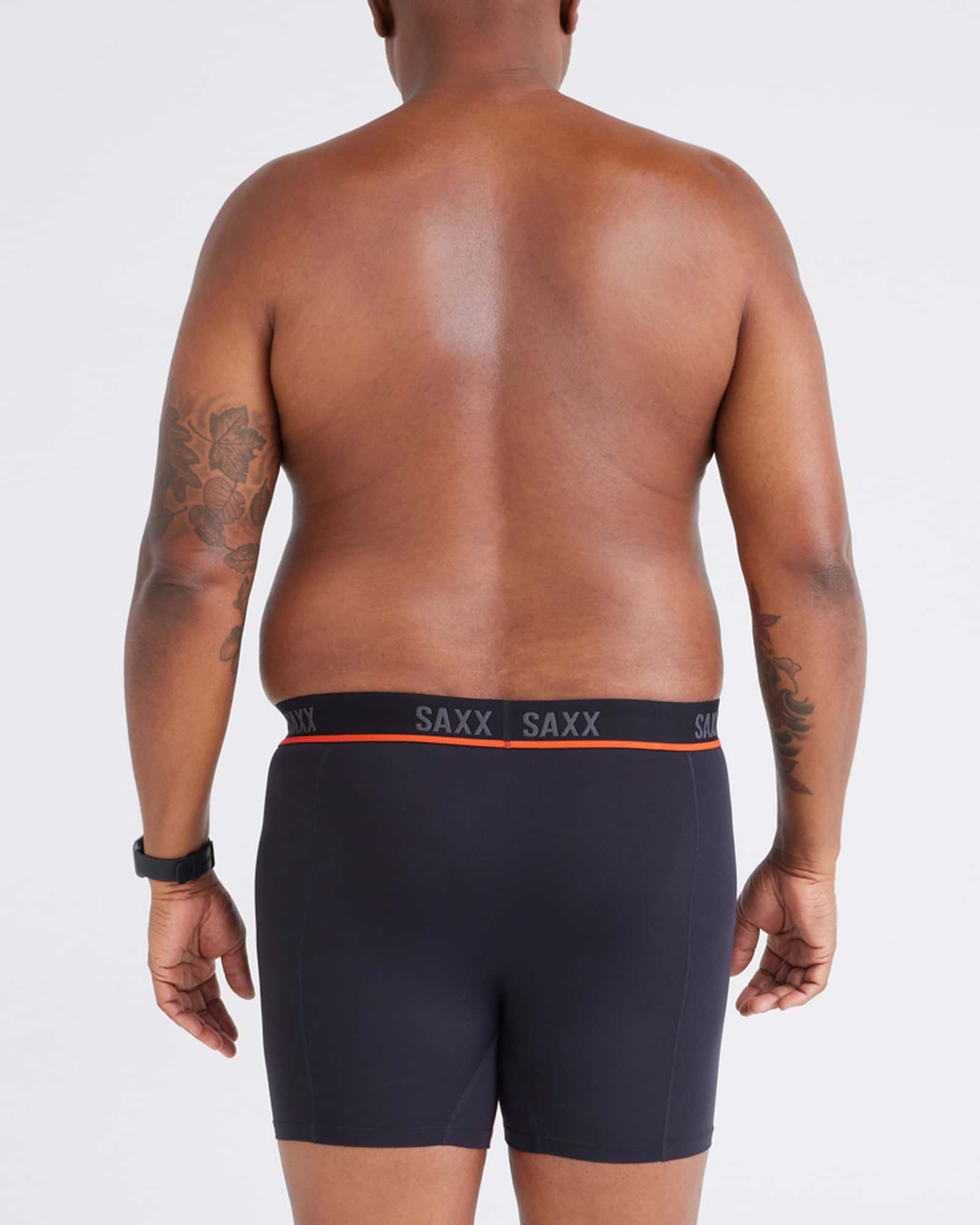 Back - Model wearing Kinetic Light-Compression Mesh Boxer Brief in Black/Vermillion