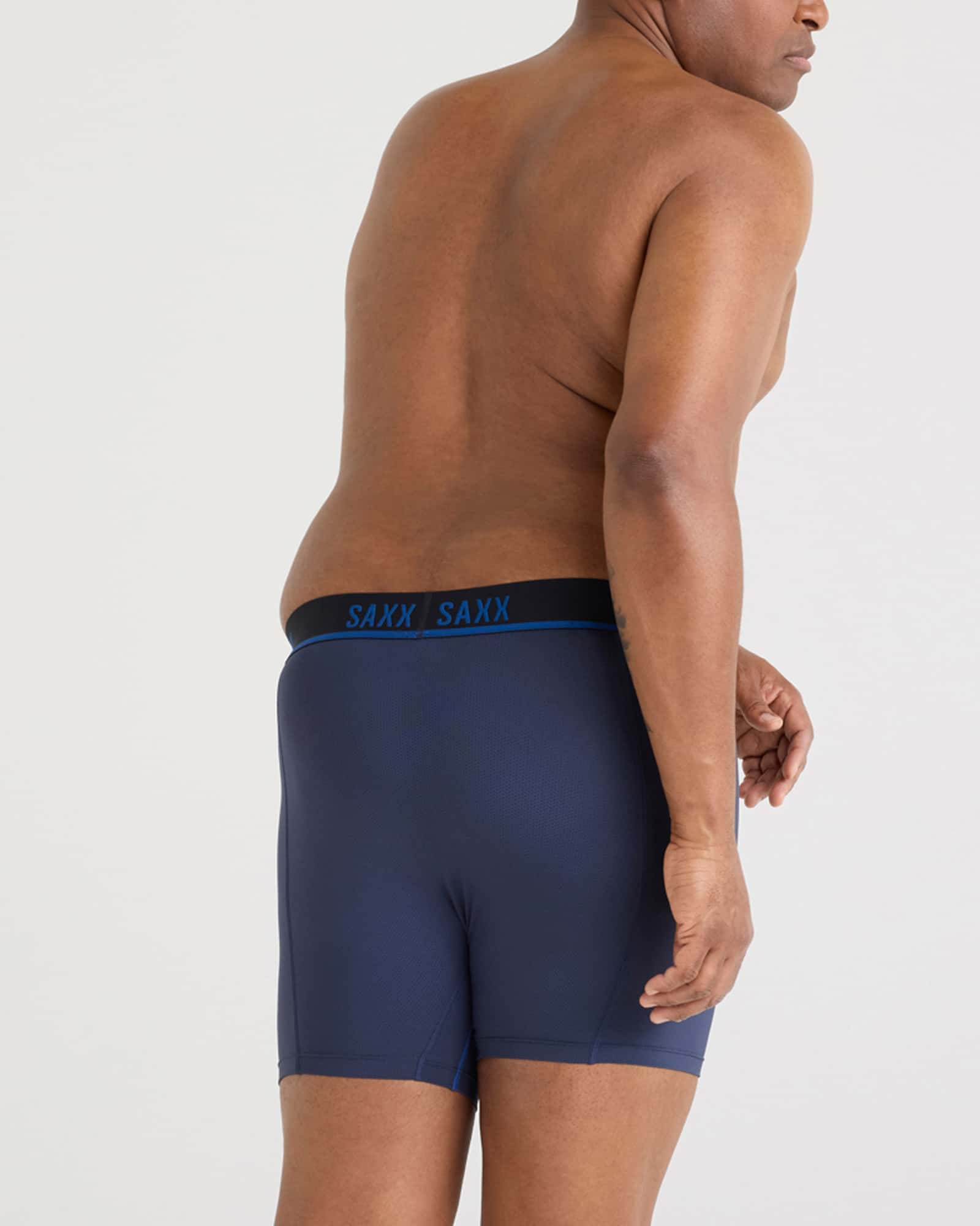 Back - Model wearing Kinetic Light-Compression Mesh Boxer Brief in Navy/City Blue