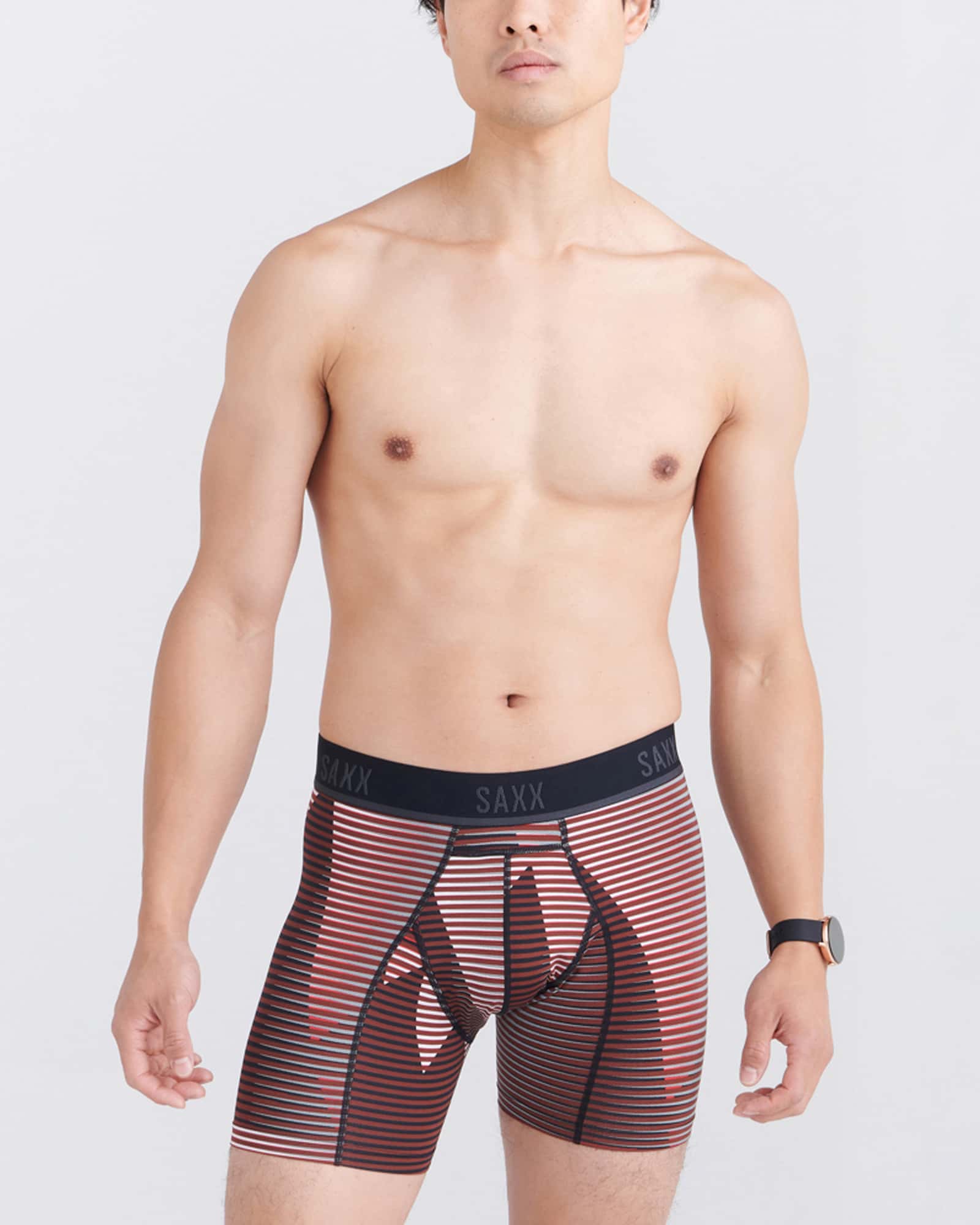 Front - Model wearing Kinetic Light-Compression Mesh Boxer Brief in Optic Mountain- Dark Brick