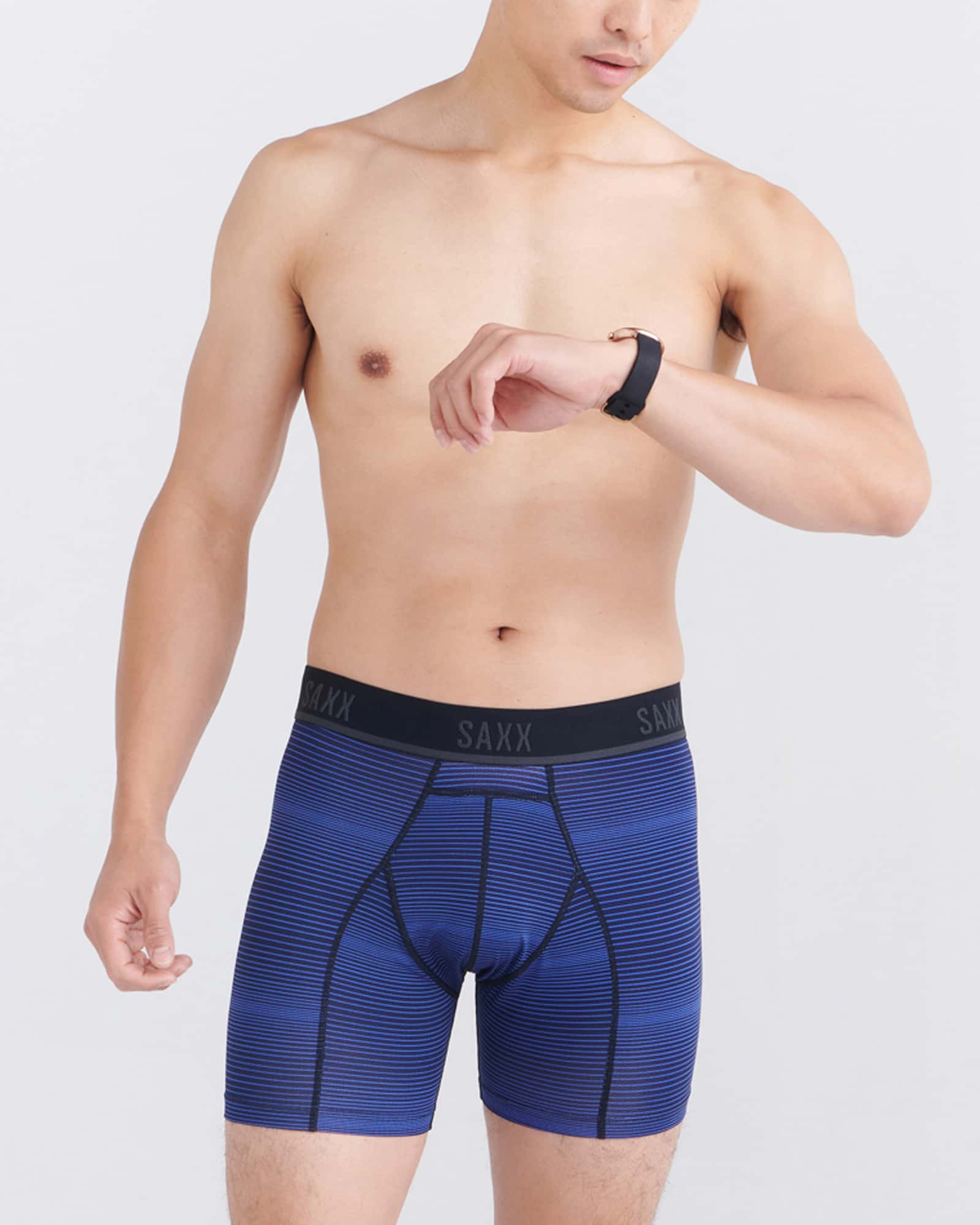 Front - Model wearing Kinetic Light-Compression Mesh Boxer Brief in Variegated Stripe- Blue