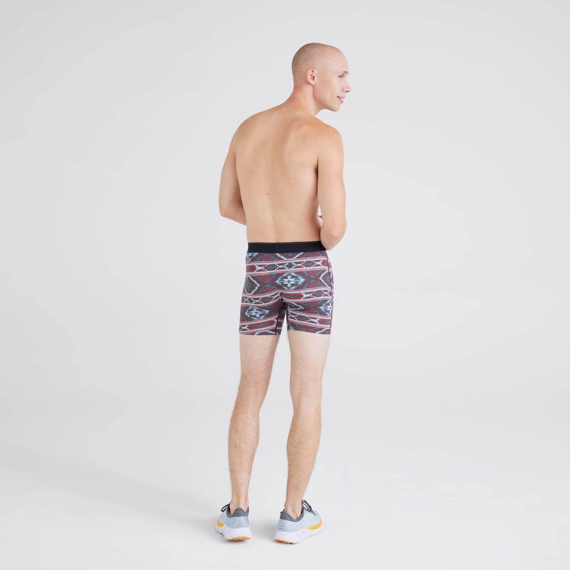 Back - Model wearing Quest Quick-Dry Mesh Baselayer Boxer Brief in Ikat Stripe-Multi