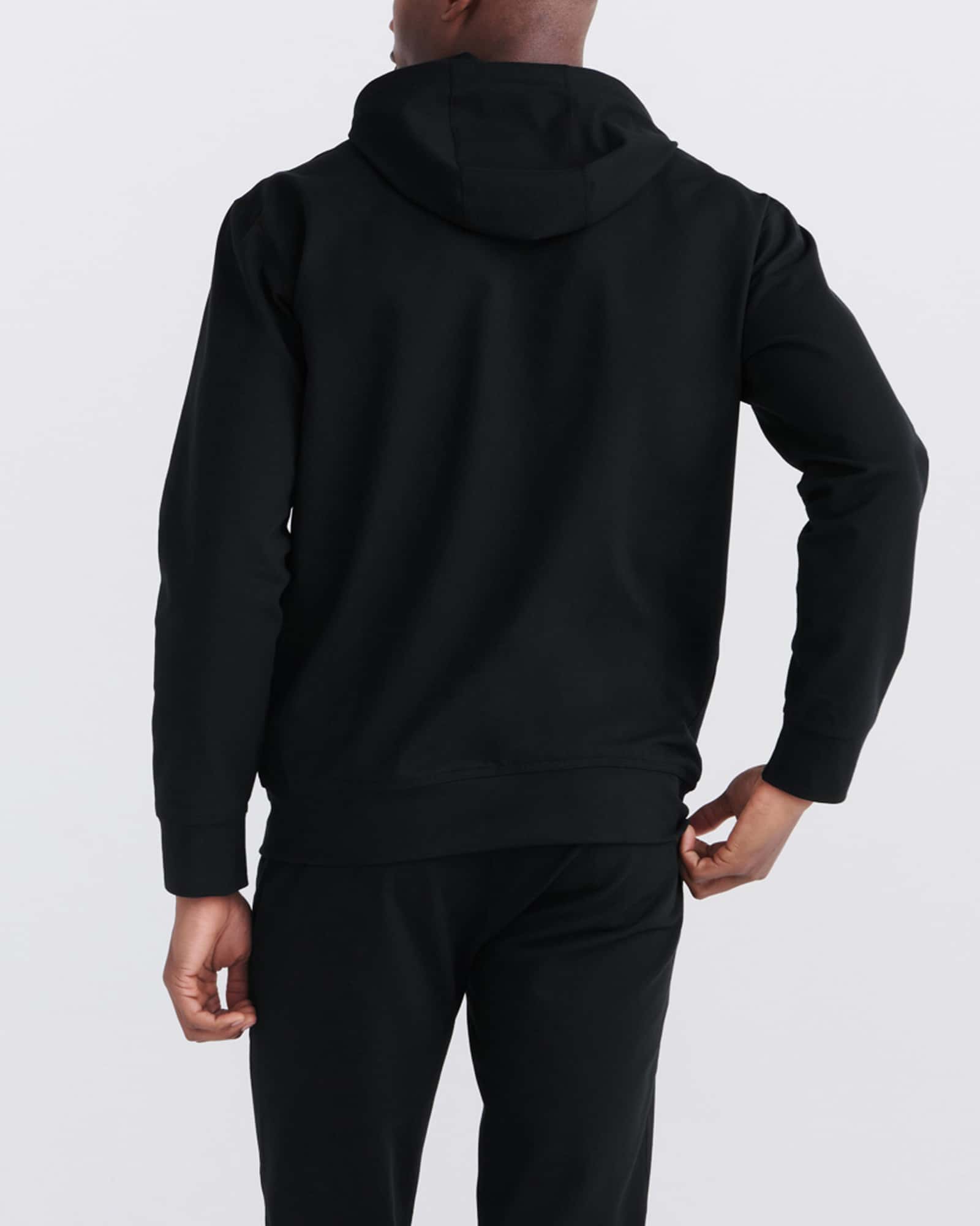 Back - Model wearing Trailzer Full Zip Hoodie in Black