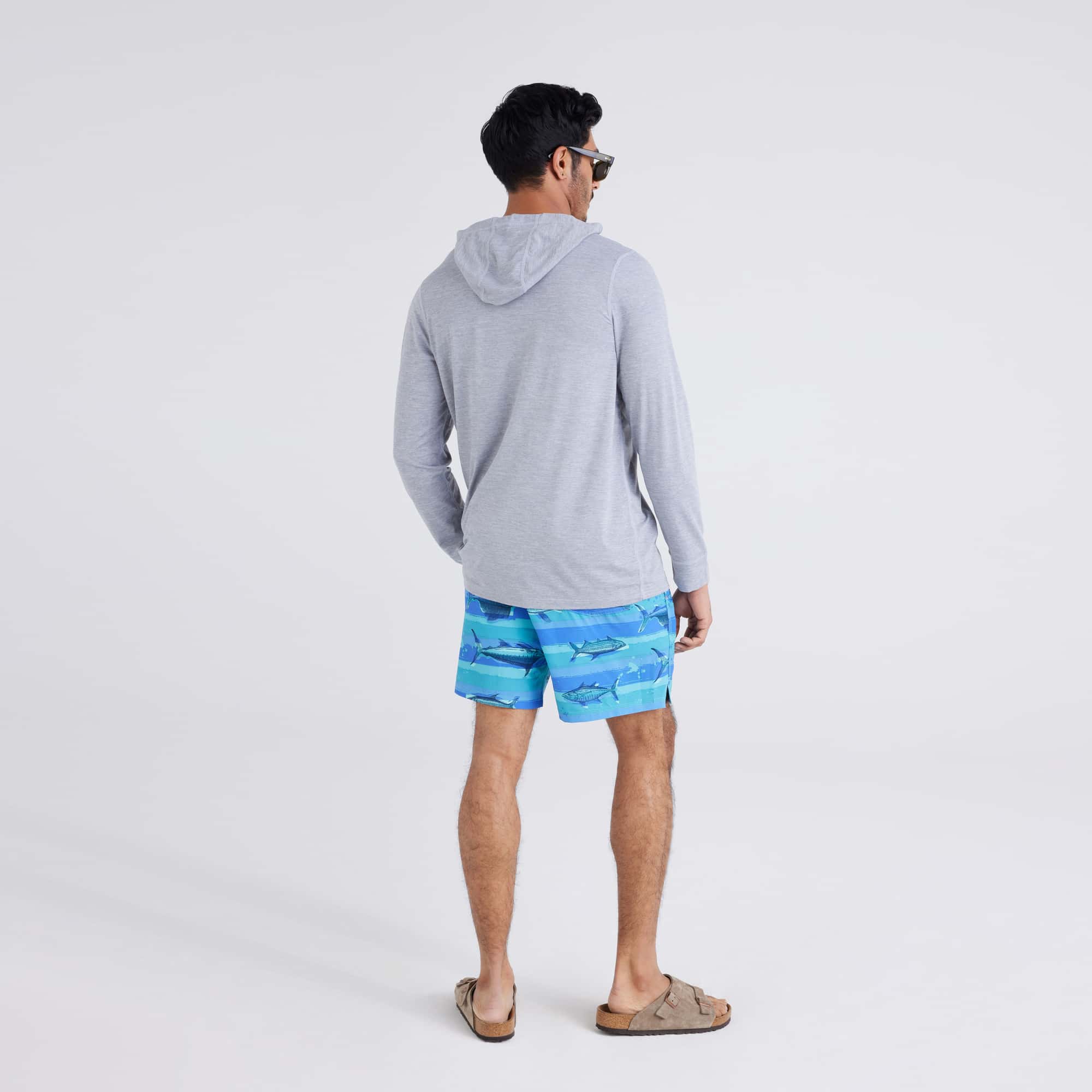 Back - Model wearing Oh Buoy 2N1 Swim Short Regular in Fish On-Blue Moon