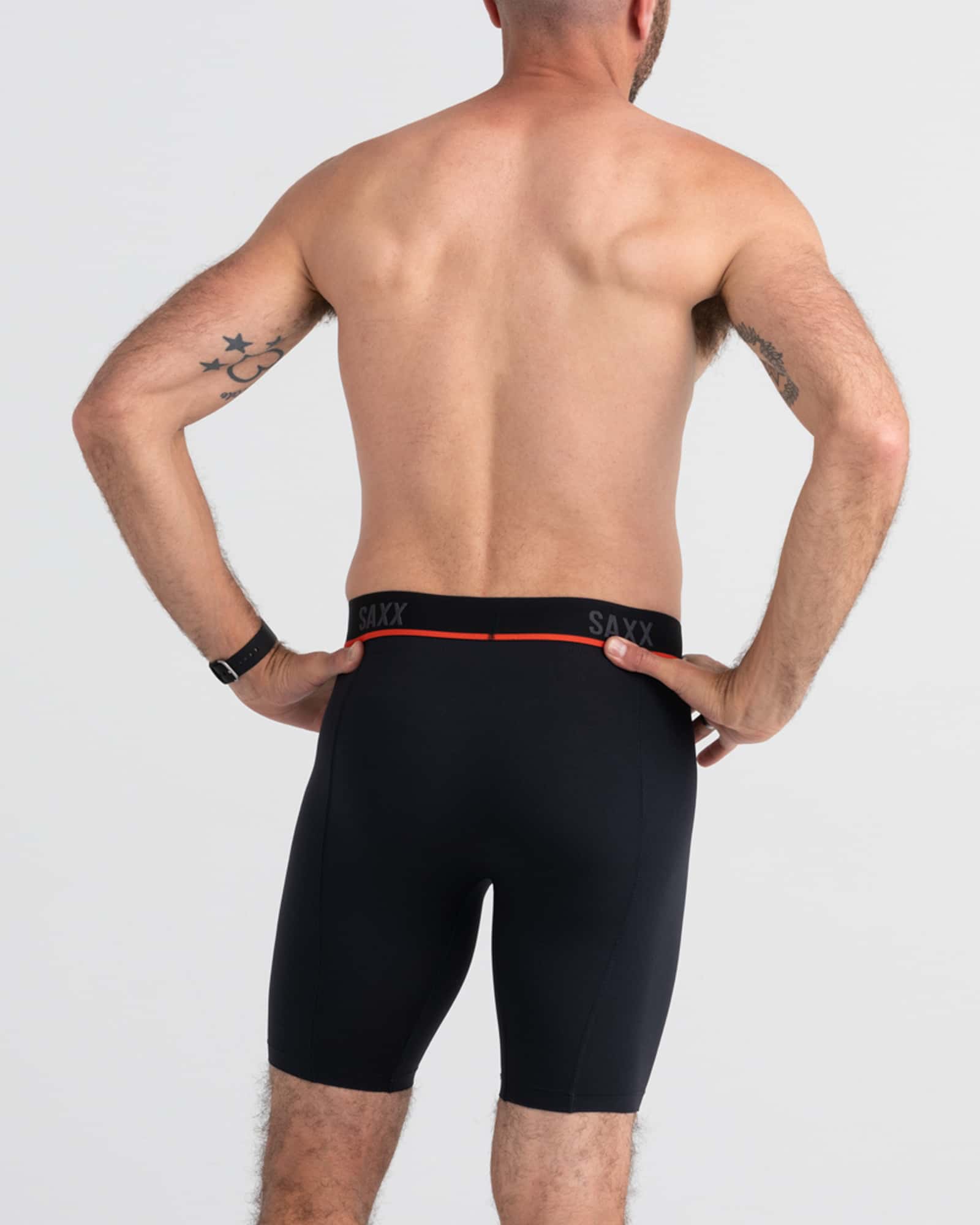 Back - Model wearing Kinetic Light-Compression Mesh Long Leg in Black