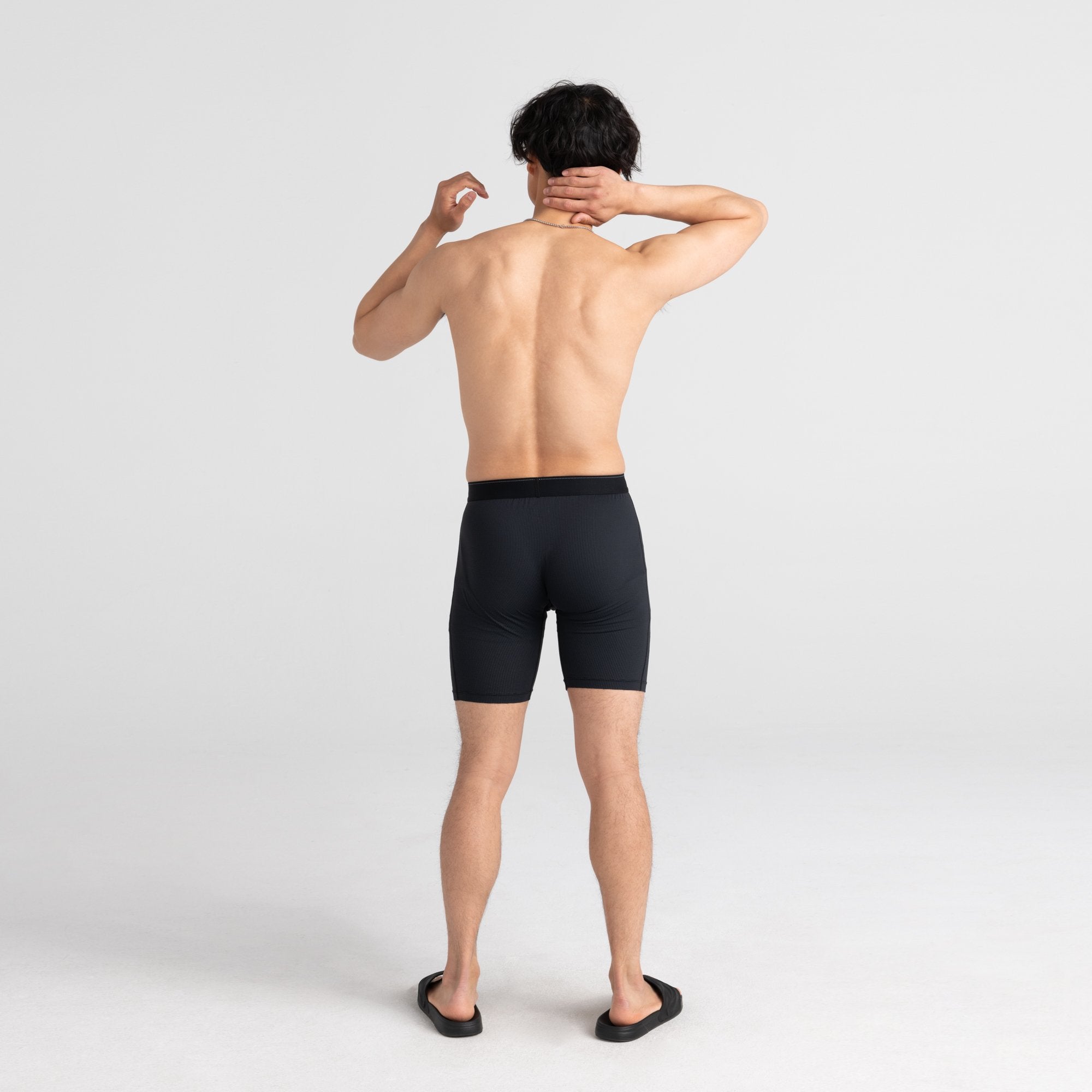 Back - Model wearing Quest Long Leg Fly in Black