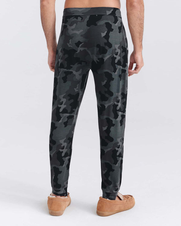 Back - Model wearing Snooze Pant in Supersize Camo- Dark Charcoal