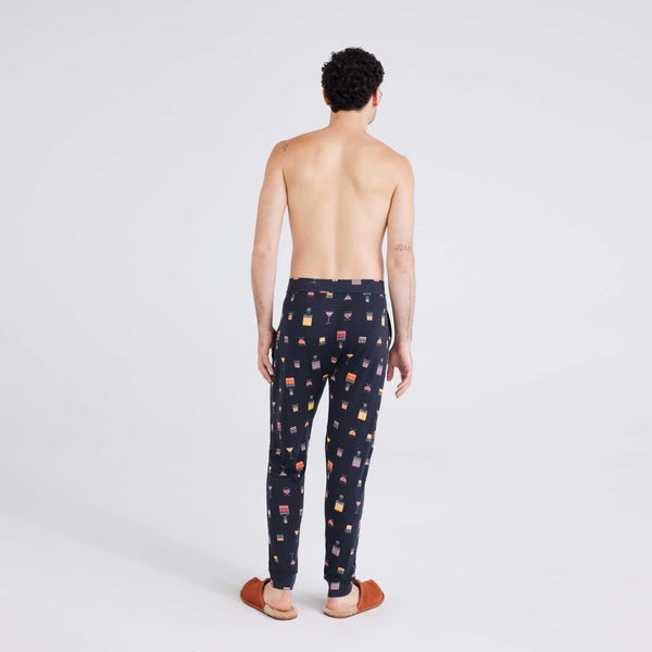 Back - Model wearing Snooze Sleep Pant in Top Shelf-Black