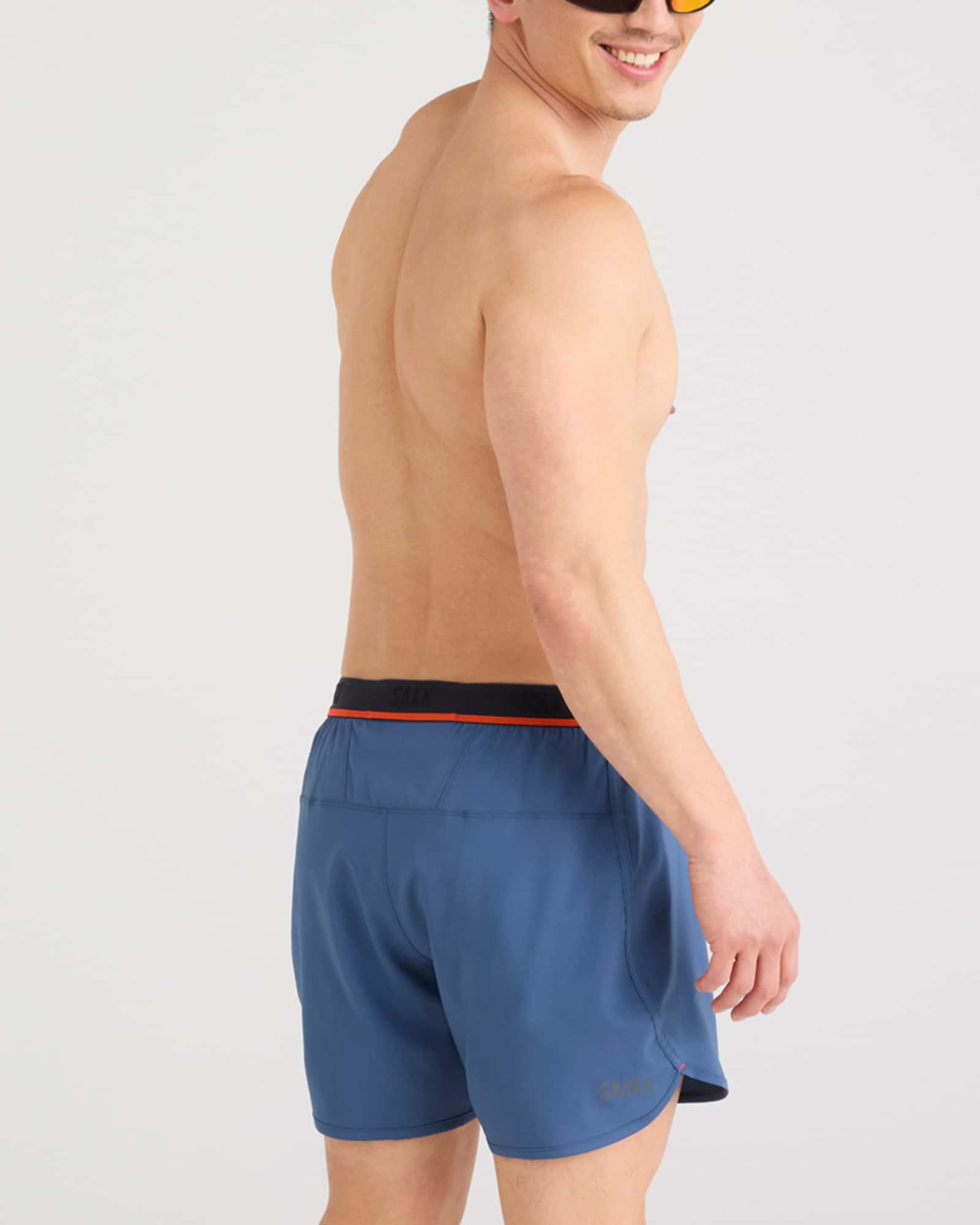 Back - Model wearing Hightail 2N1 Run Short 5" in Dark Denim