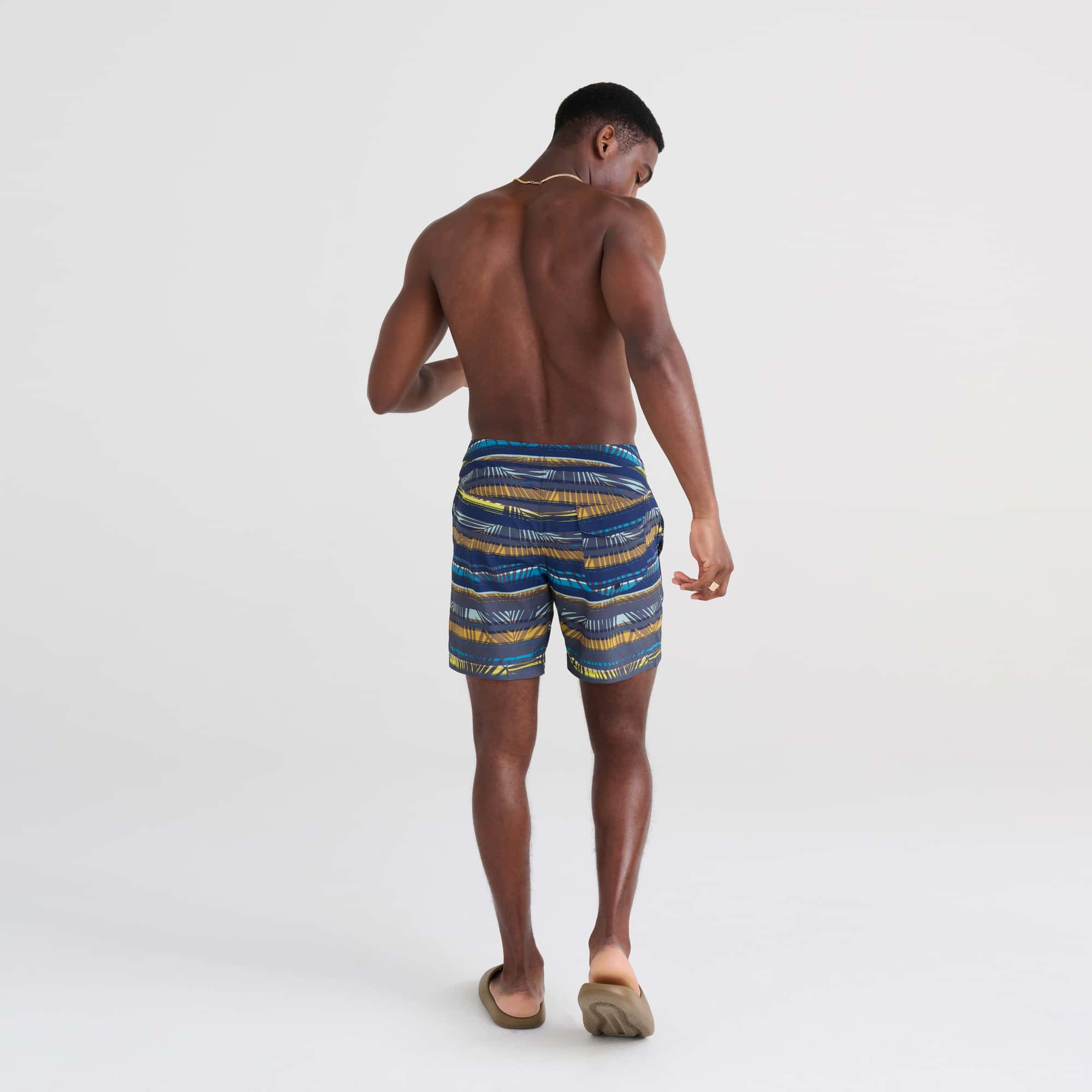 Back - Model wearing Betawave 2N1 Swim Board Short Regular in Shade Stripe- Blue Multi