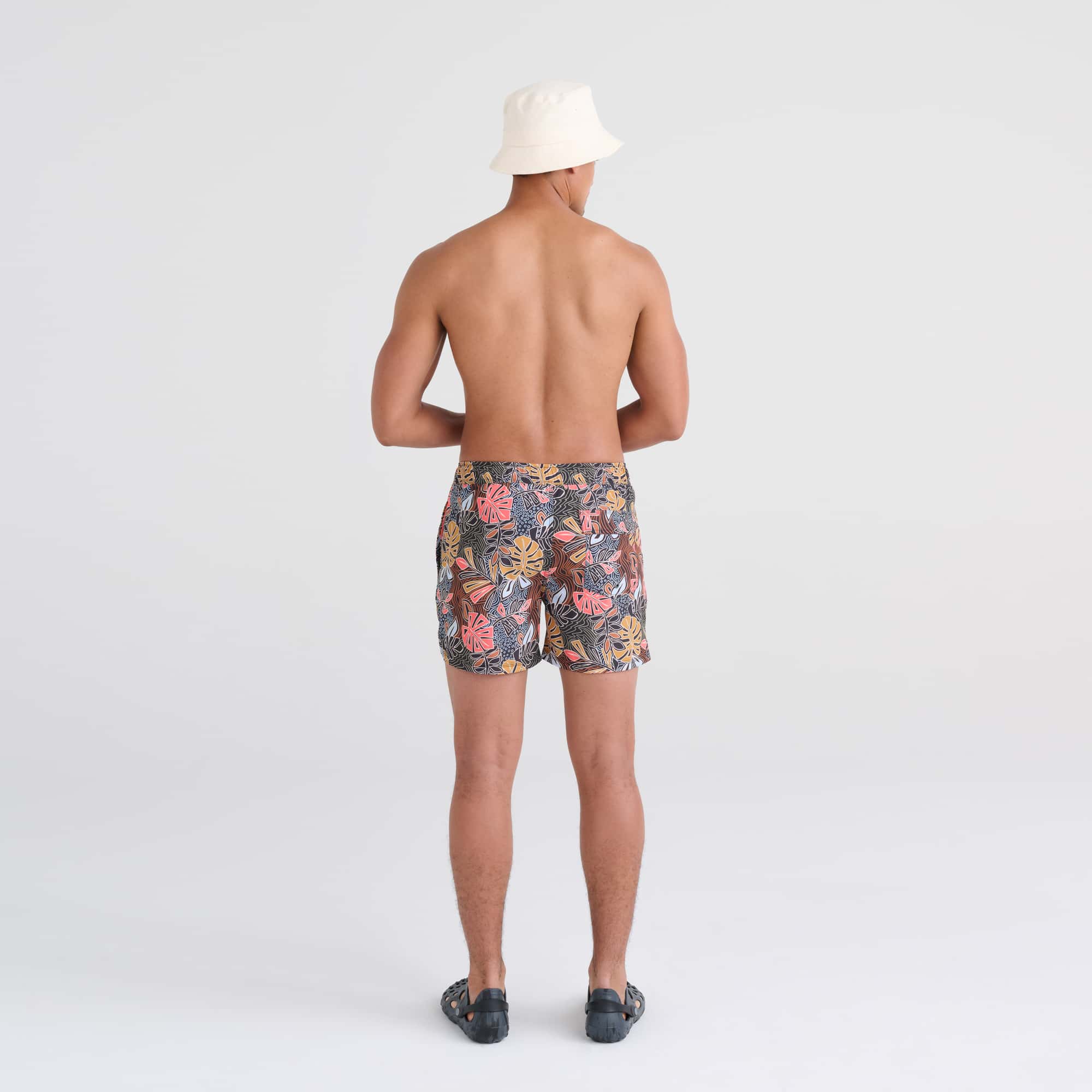 Back - Model wearing Oh Buoy 2N1 Swim Trunk 5" in Desert Palms-Harvest Mlti