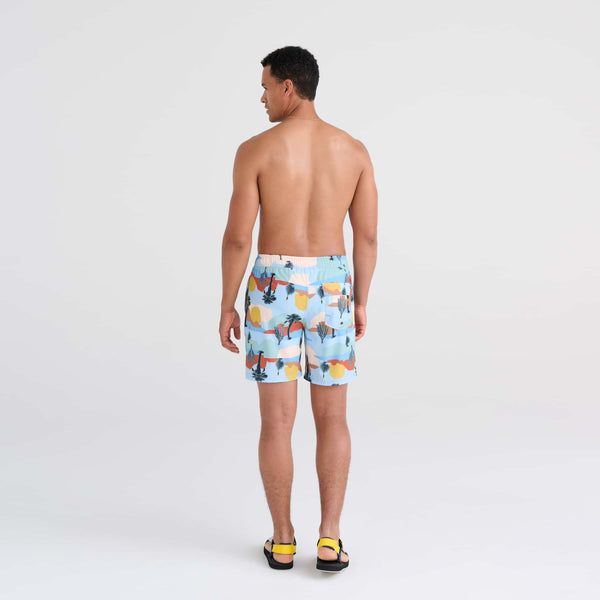 Back - Model wearing Oh Buoy 2N1 Swim Trunk 7" in Baja Bound-Chambray Multi