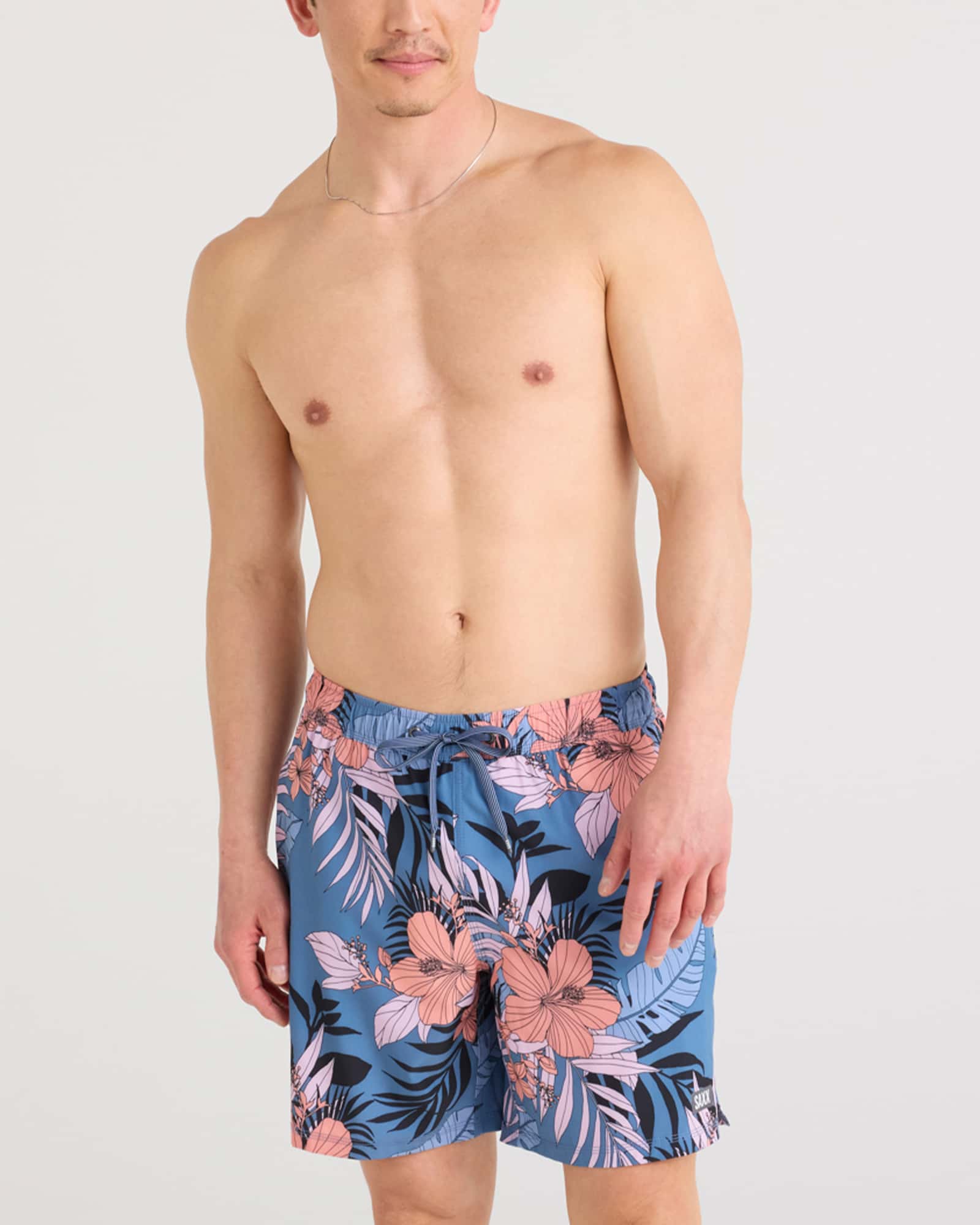 Front - Model wearing Oh Buoy 2N1 Swim Short in Hibiscus Jungle-Blue