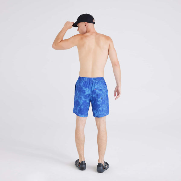 Back - Model wearing Oh Buoy 2N1 Swim Short Regular in White Noise Daisy-Blue