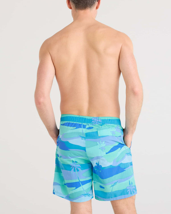 Back - Model wearing Go Coastal 2N1 Volley 7" in Bright Palms-Blue