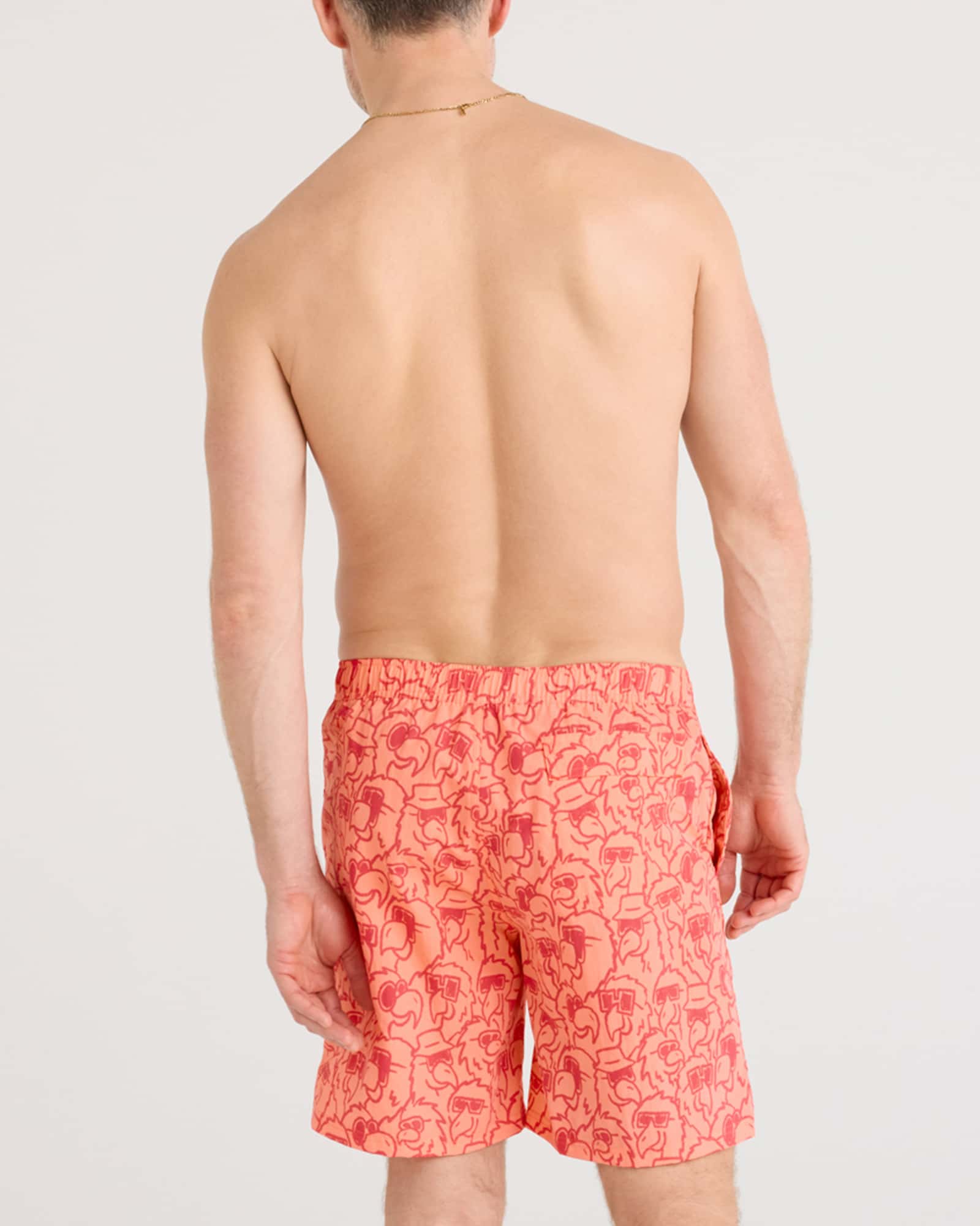 Back - Model wearing Go Coastal 2N1 Volley 7" in Parrot Party-Coral