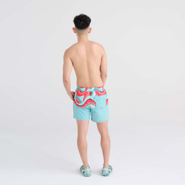 Back - Model wearing Oh Buoy 2N1 Swim Trunk 5" in Giant Wave/Sea Foam