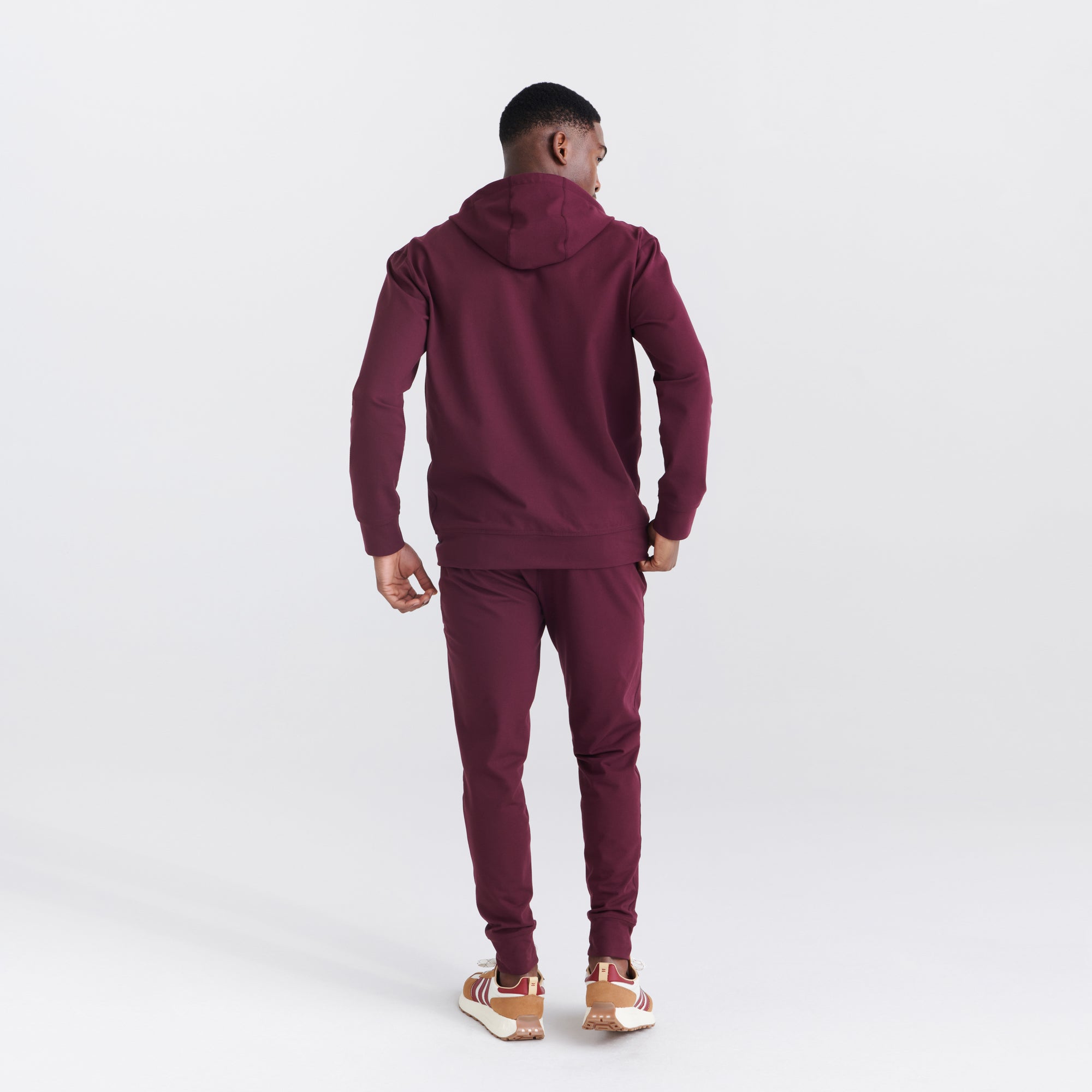 Back - Model wearing Trailzer Pant in Burnt Plum